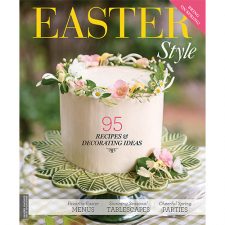 Hoffman Home & Decor Easter Style 2022 Cover Featuring White Cake With Pink Floral Trim on Green Cake Stand