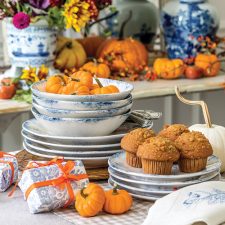 pumpkins and muffins on stacked plates