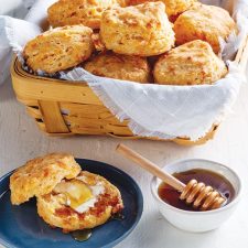 Cheddar biscuits with side of honey