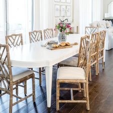 Long white table with natural wood chairs